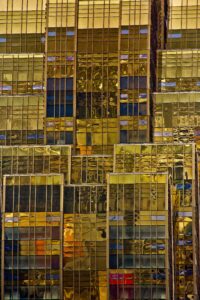 Stunning view of the golden reflective facade of a Macao skyscraper, showcasing modern architecture.